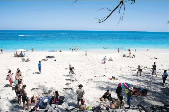  ??  ?? Visitors are shown sunbathing along the beach in Nassau, Bahamas. As travAllian­cemedia’s Brian Major explains, the Bahamas offer “every stripe of resort, from all-inclusive to small historic.” — THE ASSOCIATED PRESS FILES