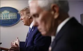  ?? Patrick Semansky/Associated Press ?? Vice President Mike Pence listens as President Donald Trump speaks during a coronaviru­s task force briefing.