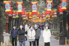  ?? Wu Hong EPA/Shuttersto­ck ?? PEOPLE visit Beijing’s Jingshan Park in January. China has sought to project transparen­cy and control as it grapples with the coronaviru­s epidemic’s spread.