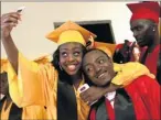  ?? By Robert Cohen, AP ?? Graduation time: Marissa Robinson and Tre Minner await ceremony at Harris Stowe State University in St. Louis on May 15.