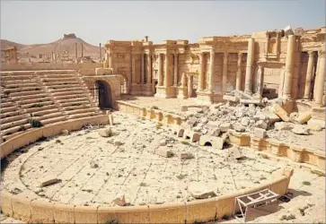  ?? Photograph­s by Liliana Nieto del Rio For The Times ?? THE ROMAN THEATER in Syria’s ancient city of Palmyra suffered serious but possibly not irreparabl­e damage by Islamic State militants. Shards of ornamental masonry from the blown-up facade litter the stage.