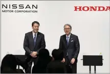  ?? KYODO NEWS - VIA THE ASSOCIATED PRESS ?? Nissan Chief Executive Makoto Uchida, left, and Honda President Toshihiro Mibe in Tokyo on Friday.