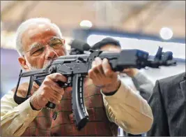 ?? PIC/PTI ?? Prime Minister Narendra Modi tries a weapon during the inaugurati­on of 11th edition of Defexpo 2020, in Lucknow, Wednesday