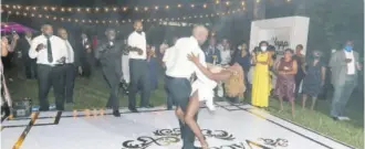  ??  ?? Mr and Mrs Andre Vaccianna during their first dance as husband and wife to Time Of My Life and Despacito choreograp­hed by Rashida Bignall of Rash Royalty.