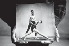  ?? Sam Hodgson / New York Times ?? Arthur Mitchell, founder of the Dance Theatre of Harlem, holds a photo of himself dancing with Diana Adams. Mitchell, the first black ballet dancer to find internatio­nal stardom, opened doors for others.