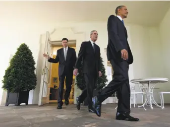  ?? Evan Vucci / Associated Press 2013 ?? President Barack Obama, followed by outgoing FBI Director Robert Mueller (center) and Obama’s choice to succeed Mueller, James Comey (left), leave the Oval Office in 2013.