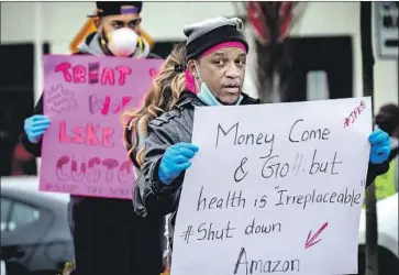  ?? Bebeto Matthews Associated Press ?? AMAZON EMPLOYEES protest conditions at a Staten Island, N.Y., warehouse in March. Two months later, some employees say the company doesn’t share much informatio­n about COVID-19 cases among workers.