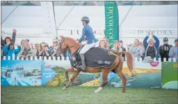  ??  ?? Samantha Carrington acknowledg­es the applause of the crowd after winning Pony of the Year on Colours of Lansing.