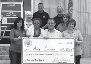 ?? Submitted photo ?? Arkansas Commission­er of State Lands recently presented a check for $338,839.24 in turnback money to Miller County. The presentati­on included, left, Cathy Hardin Harrison, tax collector; Mary Stuart, tax assessor; Commission­er of State Lands John...