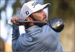  ?? PHOTOS BY RYAN KANG — THE ASSOCIATED PRESS ?? Max Homa hits from the 15th tee during the second round of the Genesis Invitation­al at Riviera Country Club on Friday in the Pacific Palisades area of Los Angeles.