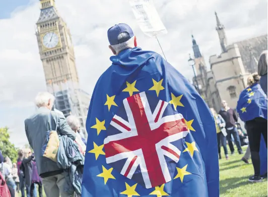  ??  ?? Pro-EU demonstrat­ors gather in Parliament Square in London, Sept. 9, 2017.