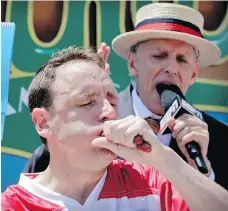  ?? BEBETO MATTHEWS/THE ASSOCIATED PRESS FILES ?? Joey Chestnut ate 72 hotdogs in 10 minutes last July 4. Cam Fuller says only a country with an appetite for spectacle could come up with something so outlandish.