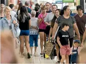  ?? PHOTO: CHRIS MCKEEN/ STUFF ?? Shoppers queued outside Westfield Albany stores before they opened at 10am yesterday.