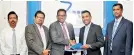  ??  ?? SLT CEO Kiththi Perera (Left) and SAT Director Feroze Kamardeen at the signing ceremony