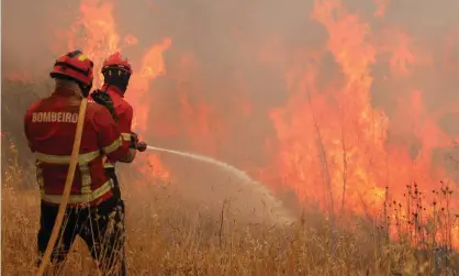  ?? Photograph: Miguel A Lopes/EPA ?? A forest fire ravages the Rasmalho area of Monchique, Algarve, southern Portugal, on Tuesday.