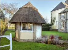  ??  ?? ABOVE: A thatched hut in the grounds
RIGHT: The dining table is from England, while the chairs are reproducti­ons of chairs in Luttrellst­own by Hicks of Dublin
TOP RIGHT: This sitting room has glass on three sides, so it gets the morning, afternoon...