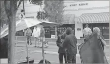  ??  ?? Crew get ready to try another take during a brief rain scene for “Hap and Leonard” on Cedartown’s Main Street.SJ, Kevin Myrick /SJ