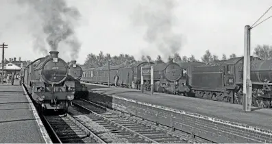  ?? TRANSPORT TREASURY/NEVILLE STEAD COLLECTION ?? Action station: Skegness is a hive of activity as three B1 class 4-6-0s and a J39 class 0-6-0 await departure. The photograph is undated but No. 61112 has a 40A Lincoln shedplate, indicating a possible date of 1952/53, when the B1 was shedded there. This engine, and what is believed to be No. 64827 next to it, both sport excursion reporting numbers, possibly for trains to Lincoln and Nottingham respective­ly, while beside the station’s running-in board, No. 61138 also has a reporting number and may be at the head of a train for York. On the far right, No. 61110 was allocated to Ardsley (37A) from 1952, so may be on a West Riding excursion. Skegness station opened in July 1873 and is still open today, handling a third of a million passengers annually, and will be a core theme of a Talisman Railwayana auction.