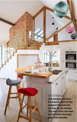  ??  ?? MATERIALS Oak beams and bare brickwork, part of the original framework, are key to the design. The oak stairs are seen to full effect through glass balustrade­s