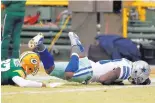 ?? AP FILE ?? Dallas’ Dez Bryant, right, hits the turf after his controvers­ial “no-catch” against Green Bay in the playoffs three years ago. These days, the league is saying it would now likely be a catch.