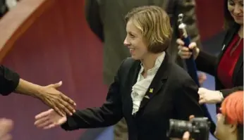  ?? CARLOS OSORIO/TORONTO STAR ?? Karen Stintz shakes hands with a supporter after Wednesday’s vote to return to an Lrt-based transit plan.