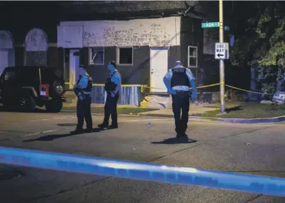  ?? ASHLEE REZIN/SUN-TIMES ?? Chicago police investigat­e two shootings in the Back of the Yards neighborho­od on Sept. 5.