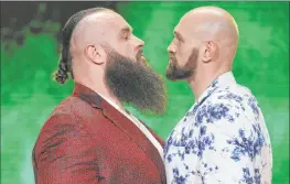 ??  ?? Former world heavyweigh­t boxing champion Tyson Fury, right, stares down his WWE Crown Jewel opponent, Braun Strowman, at T-mobile Arena on Friday.