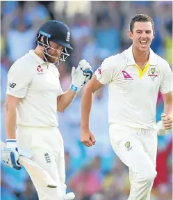  ?? Picture: Getty. ?? Josh Hazlewood celebrates taking the wicket of a dejected Jonny Bairstow with the last ball of the day.