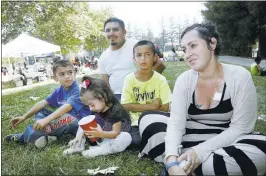  ?? KARLMONDON/STAFF ?? To help pay medical costs as she undergoes chemothera­py, Schnee Bedford-Hau, with husband Freddy Hau and their children, Merbi, 8; Melanie, 2; and Jorge, 10, holds a fundraiser at Serra Park in Sunnyvale. Bedford-Hau has been given three months to live.