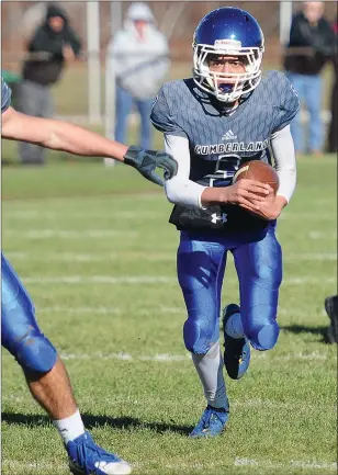  ?? Photo by Ernest A. Brown ?? Cumberland's Dante Aviles-Santos takes off with the football during last year's Thanksgivi­ng game against Woonsocket. Now a junior, Aviles-Santos will serve as one of the Clippers' top pass-catching threats this season.