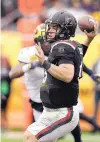 ?? CHRIS O’MEARA/AP ?? South Carolina quarterbac­k Jake Bentley passes during his team’s comeback victory over Michigan. He threw for 239 yards and two touchdowns.
