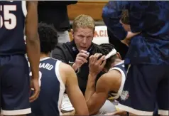  ?? RICH PEDRONCELL­I THE ASSOCIATED PRESS ?? In this Feb. 4, 2021, file photo, Gonzaga coach Mark Few huddles with his team during a timeout in the second half of an NCAA college basketball game against Pacific in Stockton, CA.