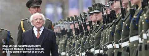  ??  ?? EASTER 1916 COMMEMORAT­ION: President Michael D Higgins inspects an Army guard of honour at the GPO