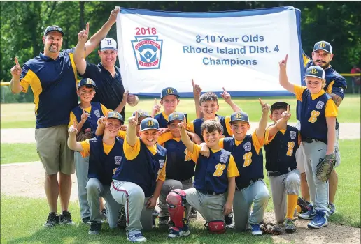  ?? Photo by Ernest A. Brown ?? The Burrillvil­le 10-year-old all-star team celebrates its 10-5 District 4 title winning victory over Smithfield Saturday afternoon at Whipple Field.