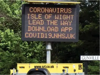 ??  ?? ISLAND PRIDE: A sign on the Isle of Wight proclaims how it is leading the way and, right, resident Emma Appell who hopes the app will help the UK