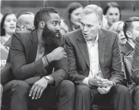  ?? Yi-Chin Lee / Staff photograph­er ?? The Rockets’ James Harden, left, confers with coach Mike D’Antoni on the bench, but D’Antoni would prefer the guard be on the court.