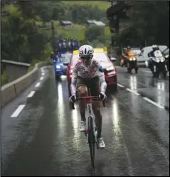  ?? Associated Press ?? STAGE WINNER — Australia’s Ben O’Connor leads as he climbs towards Tignes during the ninth stage of the Tour de France cycling race over 144.9 kilometers (90 miles) with start in Cluses and finish in Tignes, France, on Sunday. O’Connor won the stage, while Tadej Pogacar remained the overall leader.