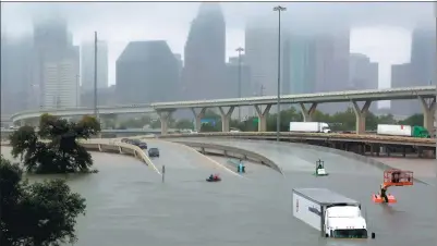  ?? RICHARD CARSON / REUTERS ?? Interstate highway 45 is submerged after torrential rain from Hurricane Harvey caused widespread flooding in Houston, Texas, on Sunday.