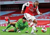  ??  ?? Level best: Alexandre Lacazette equalises for Arsenal at Emirates Stadium last night