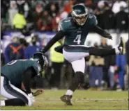  ?? MICHAEL PEREZ - THE ASSOCIATED PRESS ?? Philadelph­ia Eagles’ Jake Elliott, right, kicks a field goal as Donnie Jones holds during the first half of an NFL divisional playoff football game against the Atlanta Falcons, Saturday, Jan. 13, 2018, in Philadelph­ia.