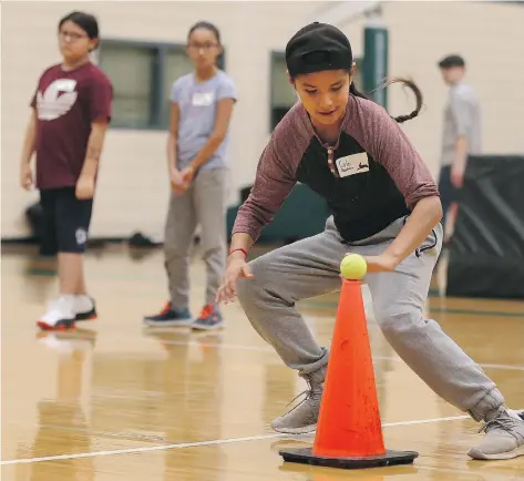  ?? MICHELLE BERG ?? Cole Rabbitskin trains Sunday during the first day of a new Indigenous youth athletics program called the Leadership Through Sports Program hosted by the College of Kinesiolog­y, Huskie Athletics and the University of Saskatchew­an at the Physical...