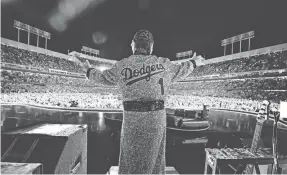  ?? PROVIDED BY BEN GIBSON ?? Elton John ends his concert at Dodger Stadium on Sunday in throwback attire.