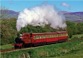  ??  ?? VINTAGE SIGHT: Douglas to Port Erin train and, below, Laxey Wheel