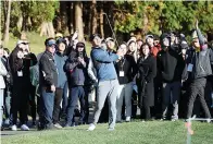  ?? Park Ji-ho/Yonhap via AP ?? ■ Brooks Koepka of the United States watches his shot on the 10th hole during the first round of the CJ Cup PGA golf tournament Thursday at Nine Bridges on Jeju Island, South Korea.