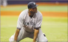  ?? Mike Carlson / Getty Images ?? The Yankees’ CC Sabathia reacts after a throwing error in the fifth inning against the Rays on Friday.