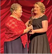  ?? ?? Mary Colbert of Palace Players accepting the Best Actress Award from Regina Bushell, Festival Director of the RTE All-Ireland Drama Festival, in Athlone on Saturday night.