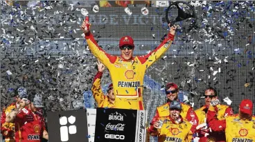  ??  ?? Joey Logano celebrates in Victory Lane after winning a NASCAR Cup Series race Sunday at Phoenix Raceway in Avondale, Arizona.