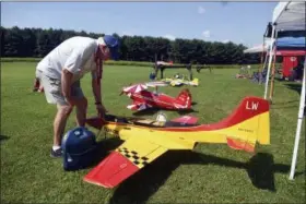  ?? JACQUELINE DORMER/REPUBLICAN-HERALD VIA ASSOCIATED PRESS ?? In this July 28 photo, Larry Wright, of Swoyersvil­le, Pa., fuels his Turbinator at the 2018 Aerorama Air Show at the Tuscarora R/C Flying Club AMA Field #574 in Barnesvill­e, Pa.