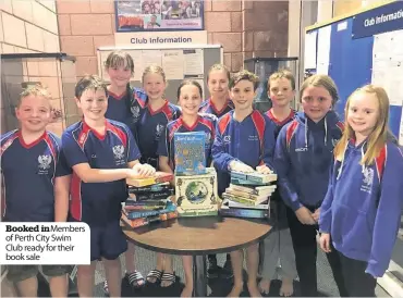  ??  ?? Booked inMembers of Perth City Swim Club ready for their book sale