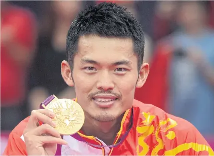  ??  ?? END OF AN ERA: Lin Dan celebrates with his gold medal after beating Malaysia’s Lee Chong Wei during the men’s singles final at the London 2012 Olympic Games.